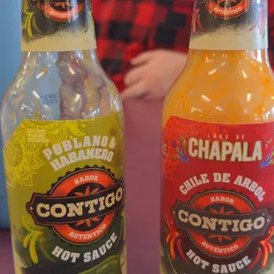two bottles of chili sauce
