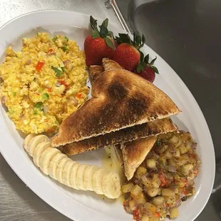 Scrambled eggs with peppers &amp; onions home fries white toast side of fruit