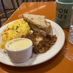 Scrambled eggs bacon toast hash browns