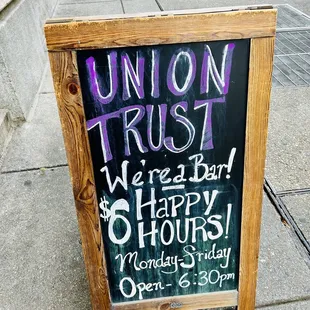 a sign on a sidewalk