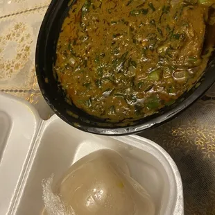 a bowl of soup and a container of rice