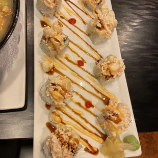 a plate of sushi and a bowl of soup