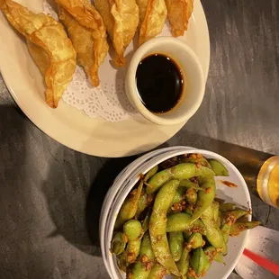 a plate of fried food and a bowl of dipping sauce