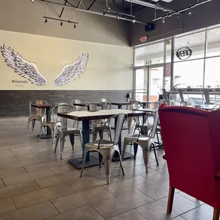 a restaurant with tables and chairs