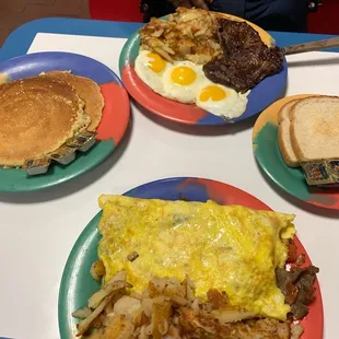 Gyro skillet, pancakes and ribeye steak with three eggs.