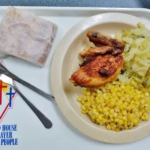 Roast chicken, cabbage, corn and corn bread.