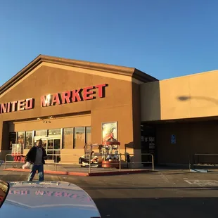 a man standing in front of a store