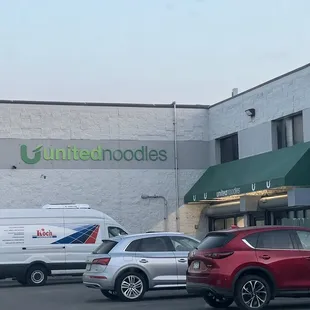 cars parked in front of a building