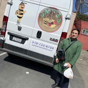a man standing in front of a van