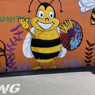 a bee with a basket of flowers