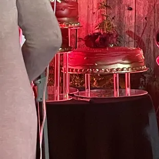 a man standing in front of a cake