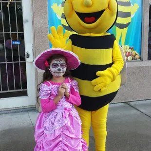 a little girl dressed as a bee