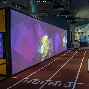 Race an athlete on our interactive, 20-meter track!