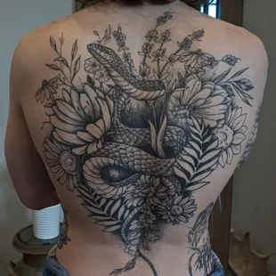 Discover the exceptional artistry of Cory 'Mr. Blankets Sheets' with a Black &amp; Grey illustrative backpiece.