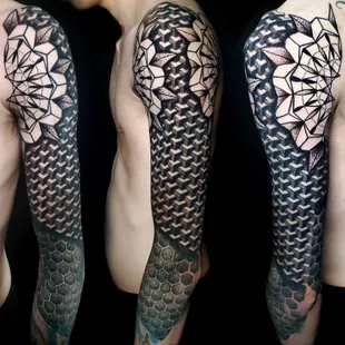 Experience the mesmerizing fusion of art and geometry in this black and grey sacred geometry sleeve masterpiece by John Lapides.