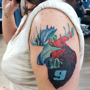 Mesmerizing color abstract Moose surrealism style tattoo by artist Sole. This unique and imaginative design combines abstract elements.