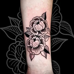 Dive into the timeless artistry of a black and grey traditional style tattoo crafted by the skilled hands of John Lapides.