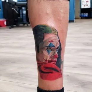 Vibrant and detailed color realism tattoo featuring the iconic portrait of the Joker, created by the talented artist Sole.