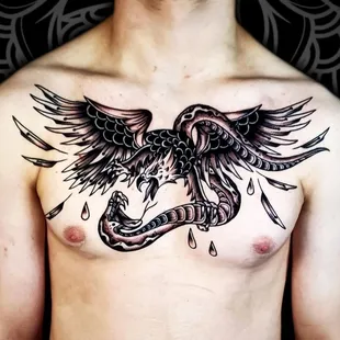 Dive into the timeless artistry of a black and grey traditional style tattoo crafted by the skilled hands of John Lapides.