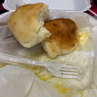 a half eaten biscuit and a fork