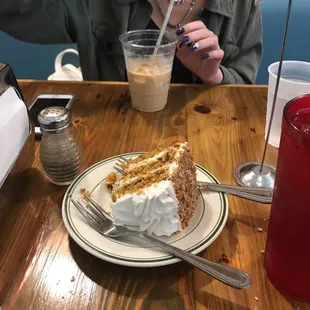 a woman eating a piece of cake