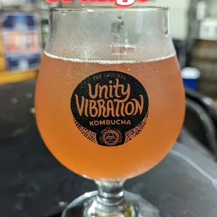 a glass of beer on a table