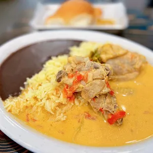 Pollo en Crema y Loroco: Chicken in cream sauce, herbs, vegetables, rice, choice of tortillas or pan francés | $16.95