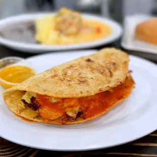 Doblada: Shredded beef, cabbage, grilled onions,  salsa, handmade tortilla | $7.75