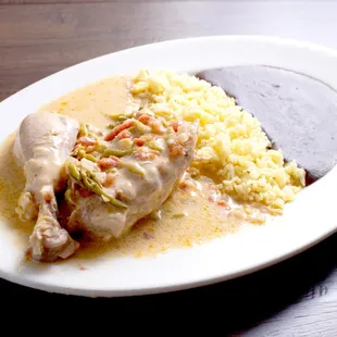 a plate of food on a wooden table