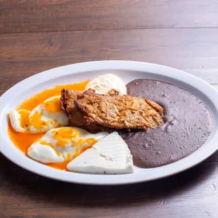 a plate of food on a wooden table