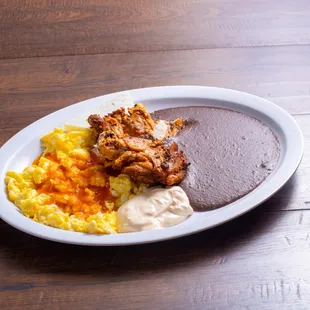a plate of food on a wooden table