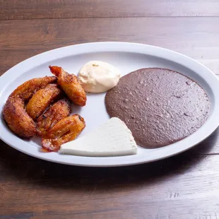 a plate of food on a wooden table