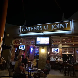 the outside of a restaurant at night