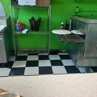 a kitchen with a checkered floor