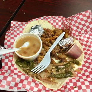 Amazing sweetbread tacos with grilled onions and peppers plus charro beans