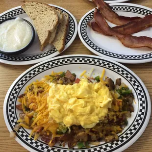 Bacon skillet with extra bacon, grits and rye toast