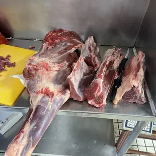 Hands slaughtered beef. Here we have shoulder and Tbone&apos;s steak