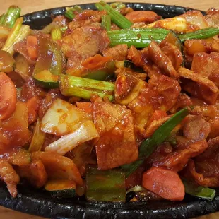 Jae Yuk Bokum. Delicious but it is not made with kimchi. However,  I  am sure it can be requested.