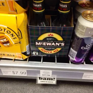a shelf of beer and cans