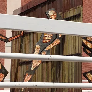The sculpture is a clue that you are getting close. It is in front of another building.