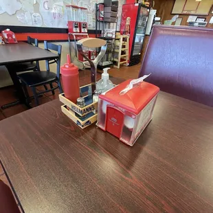 a table with condiments and condiments