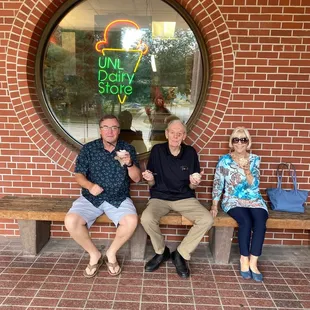 Patrons w ice cream sitting in front of UNL Dairy Shop