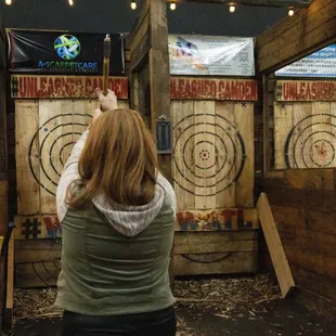 a woman shooting at a target