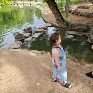 My niece adrianna waiting to feed the duckies