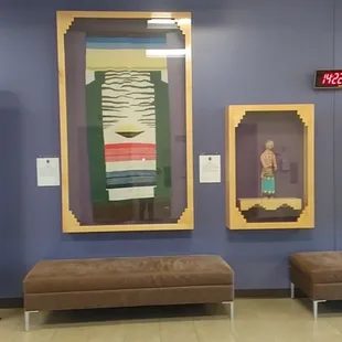 Art work on the wall opposite the elevator doors.