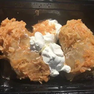 9.99 Stuffed Cabbage was so tender I ate it with a plastic spoon. Two rolls, filling is ground meat &amp; rice, he asked if I wanted sour cream.