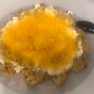 One order of hash browns (macok on the menu) topped with sour cream and cheese. Coworkers loved their samples!