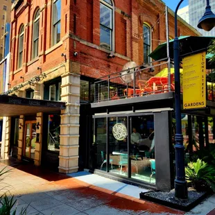 a brick building with a clock on the front