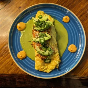 an omelet on a blue plate