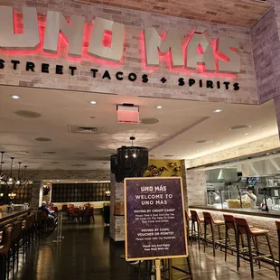 a sign in front of a restaurant